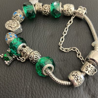 Beautiful pandora style bracelet with green glass beads with 925 markings
