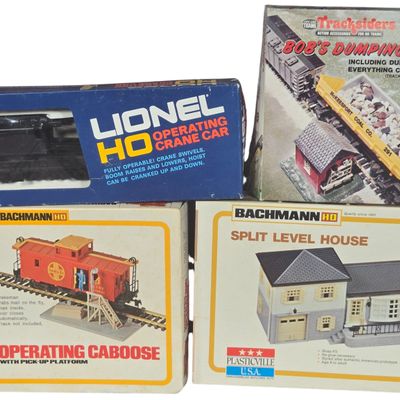 A Collection of Four Vintage HO Scale Model Train Accessories and Building Kits by Lionel, Bachmann, and Life-Like