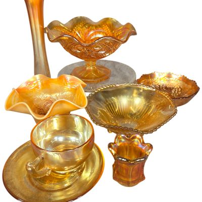 An Assortment of Marigold Carnival Glass Tableware