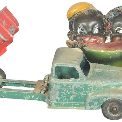 Three Vintage Toys Including a Hubley Ford Dump Truck and Black Americana Collectibles