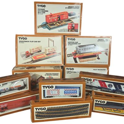 A Collection of Eleven Tyco HO Scale Electric Train Locomotives, Rolling Stock, and Accessory Sets