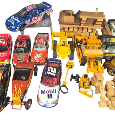 An Assortment of Die-Cast NASCAR Vehicles, Classic Cars, and Wooden Toys