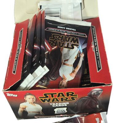 A Collection of Vintage Topps Football Trading Cards and a Star Wars The Rise of Skywalker Retail Box