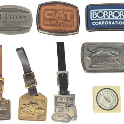 An Assortment of Eight Vintage Industrial and Heavy Machinery Advertising Collectibles Featuring Caterpillar