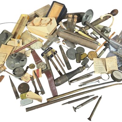 An Assortment of Vintage Watchmakers Tools Parts and Horological Ephemera