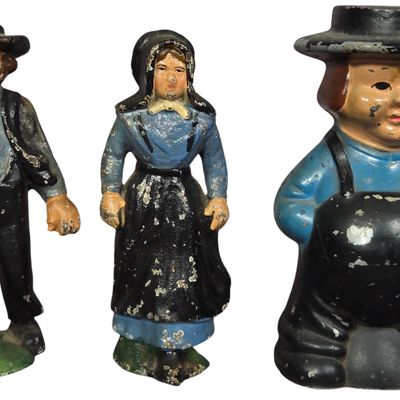 A Trio of Vintage Painted Cast Iron Amish Family Figurines