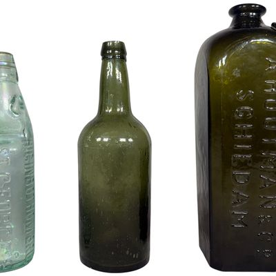 A Trio of Antique Glass Bottles including Bermuda Codd-Neck Soda and A. Houtman and Co. Case Gin
