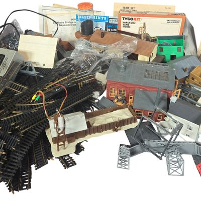 A Collection of Vintage HO Scale Model Train Accessories and Power Supplies Including MRC and American Flyer