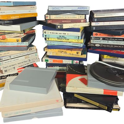 A Collection of approximately 60 Pre-Recorded and Blank 7-Inch Reel-to-Reel Audio Tapes