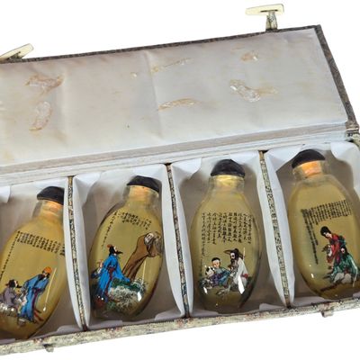 A Set of Four Chinese Inside-Painted Glass Snuff Bottles in Presentation Case