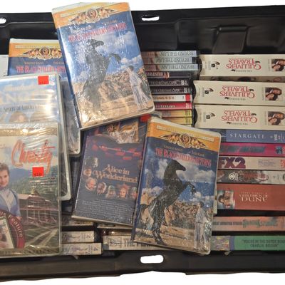 An Assortment of New Old Stock and Assorted VHS Tapes and DVDs including Feature Films and Instructional Media