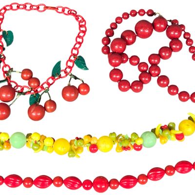 A Collection of Four Vintage Mid-Century Novelty Fruit and Red Bead Necklaces
