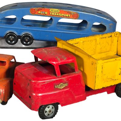 Three Vintage American Pressed Steel and Tinplate Toy Trucks Including Structo and Marx