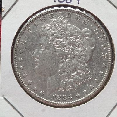 Sale Photo Thumbnail #147: 1884 Morgan Dollar, 90% Silver, 26.73g