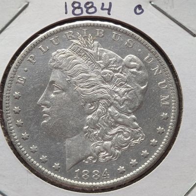 Sale Photo Thumbnail #156: 1884-O Morgan Dollar, 90% Silver, 26.73g