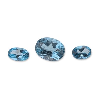 Sale Photo Thumbnail #212: Trio of Oval Faceted Light Blue Topaz Gemstones