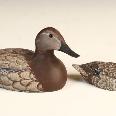 Sale Photo Thumbnail #78: Two Hand Carved and Painted Wooden Hen Duck Decoys Including a Hutch Decoy Carving Ltd. Example