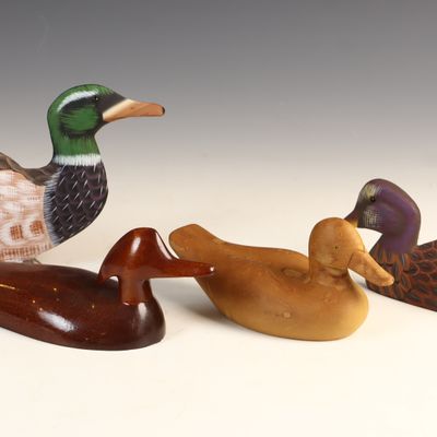 Sale Photo Thumbnail #118: A Group of Carved and Painted Wooden Duck Decoys and Decorative Figures