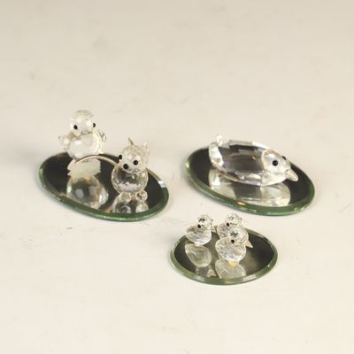 Sale Photo Thumbnail #149: A Collection of Crystal Animal Figurines and Mirrored Display Bases