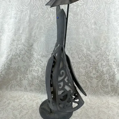 Filigree Metal Sculpture of a Figure with an Umbrella