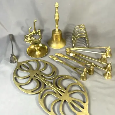 Polished Brass Decor Collection with Bell, Candle Snuffers, and Trivets