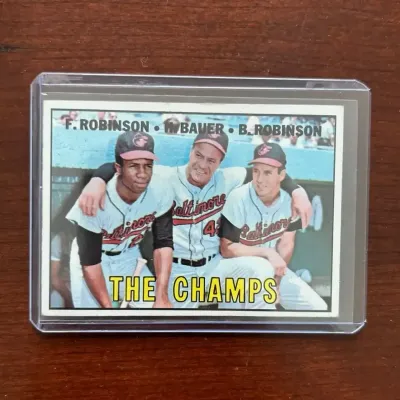 1967 Topps Baseball Card. The Champs - Frank & Brooks Robinson. Card #1