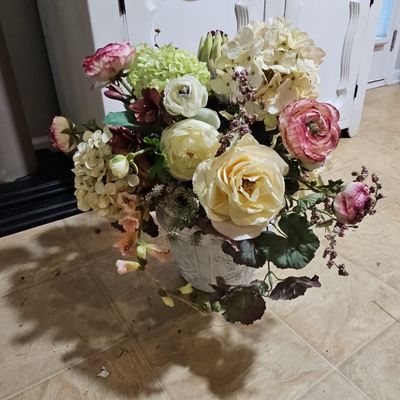 Sale Photo Thumbnail #815: Artificial Floral Arrangement with Ranunculus, Hydrangeas, and Roses in Distressed Urn