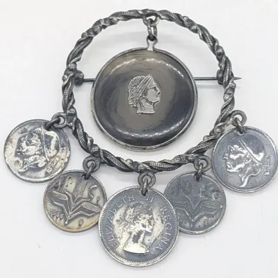Sale Photo Thumbnail #220: Silver Tone Coin Brooch
