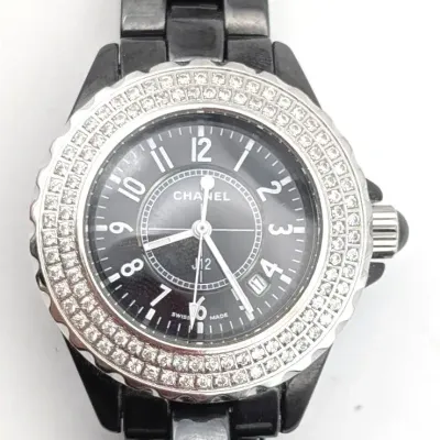 Sale Photo Thumbnail #312: Black and Silver Ladies Writst Watch 