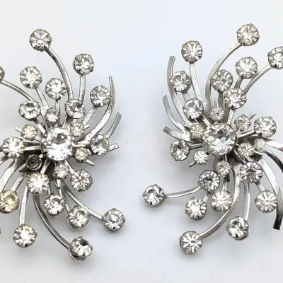 Sale Photo Thumbnail #19: Vintage Dramatic EmJ Emmons Silver Tone Mid Century Pin Wheel Clip Rhinestone Earrings.
