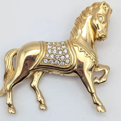 Sale Photo Thumbnail #64: Vintage Gold Tone Swarovski Horse Brooch
