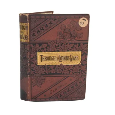 Sale Photo Thumbnail #119: ANTIQUE EDITION OF THROUGH THE LOOKING GLASS BY LEWIS CARROLL