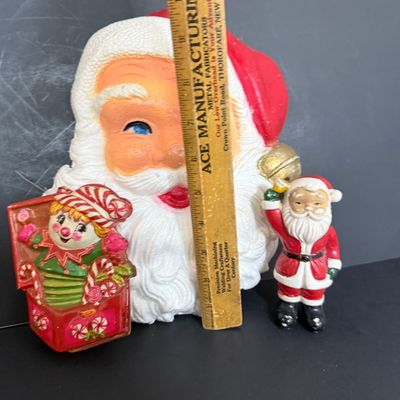 LOT 57: Vintage Holiday Christmas Decor Featuring a Styrofoam Santa Head, Ceramic Santa and a Plastic Jack in the Box Ornament