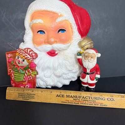 LOT 57: Vintage Holiday Christmas Decor Featuring a Styrofoam Santa Head, Ceramic Santa and a Plastic Jack in the Box Ornament