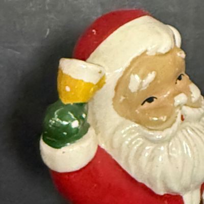LOT 57: Vintage Holiday Christmas Decor Featuring a Styrofoam Santa Head, Ceramic Santa and a Plastic Jack in the Box Ornament
