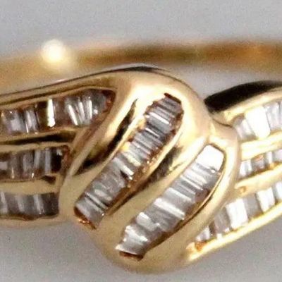 ESTATE 14k GOLD AND CHANNEL SET BAGUETTE DIAMOND RING