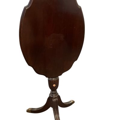 ANTIQUE MAHOGANY TILT TOP TEA TABLE ON BRASS PAW FEET