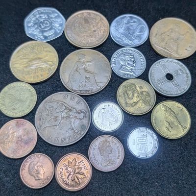 Sale Photo Thumbnail #420: (18) Assorted Foreign Coins from Mexico, Canada, Britain, Uganda etc.
