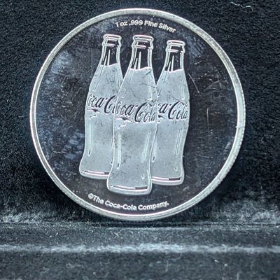 Sale Photo Thumbnail #200: Coca-Cola .999 Fine Silver 1 Troy Oz. Round