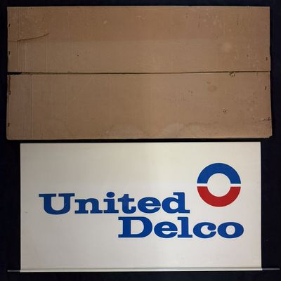 Sale Photo Thumbnail #294: NOS United Delco DST Painted Metal Hanging Sign w/ Box