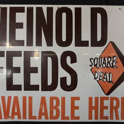 Sale Photo Thumbnail #386: Heinold Feeds Square Deal Available Here SST Metal Sign