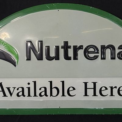 Sale Photo Thumbnail #448: Nutrena Tin Embossed Available Here Painted Metal Farm Sign