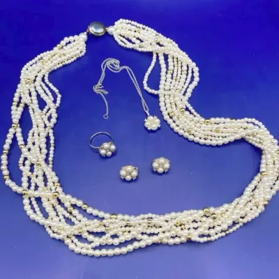 Pearl Look Costume Jewelry Two Necklaces, One Ring, And A Pair Of Clip On Earrings