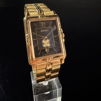 Sale Photo Thumbnail #157: Seiko Veterans of Foreign Wars Glen M Gardner Jr Commemorative Gold Tone Quartz Wristwatch