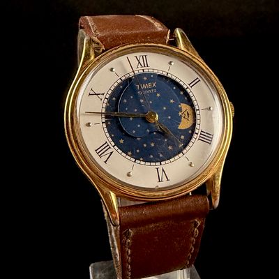 Sale Photo Thumbnail #99: Vintage Timex Gold Tone Quartz Moonphase Wristwatch
