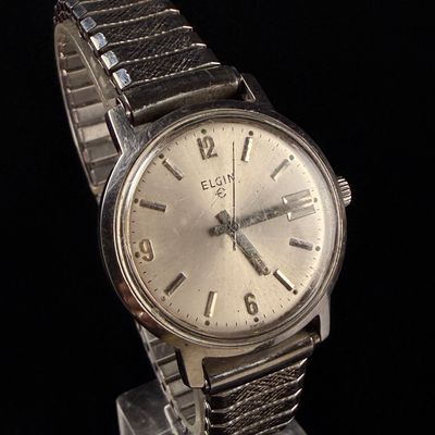 Sale Photo Thumbnail #69: Vintage Elgin Stainless Steel Swiss Manual Wind Date Wristwatch