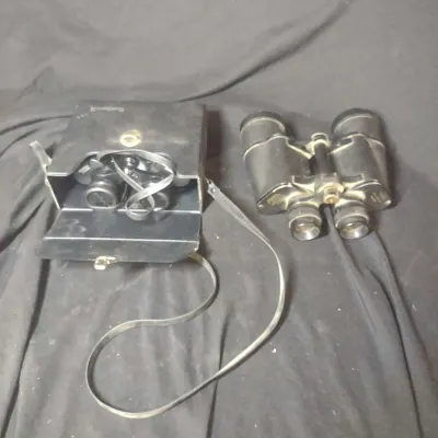 Two Pair Of Binoculars, Bushnell And Micronta