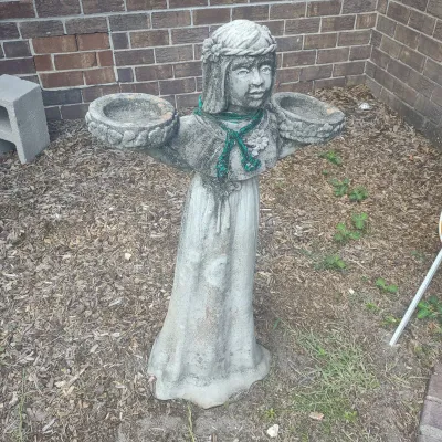 Concrete Bird Girl Statue
