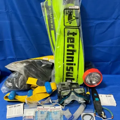 Scuba And Underwater Photography Gear Including A Camera, Flippers, Weight Belt, And More
