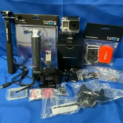 GoPro Hero 4 Camera With Memory Cards, Stands, Charger, And Other Accessories